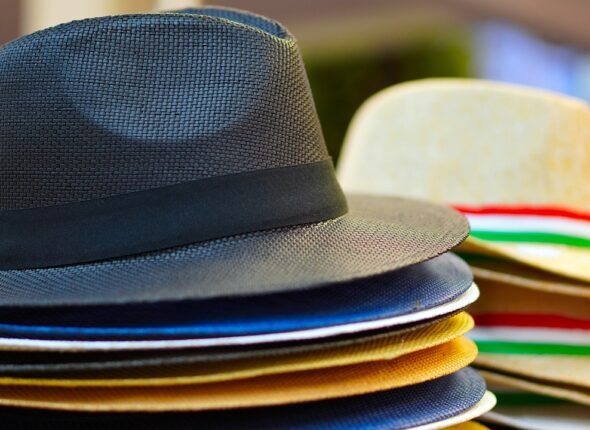Stack of colorful fedoras symbolizing versatility and multi-skilled professionals