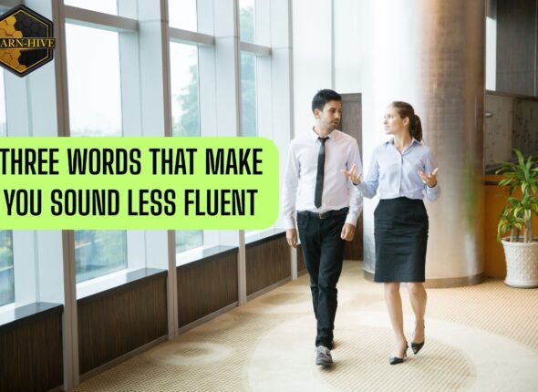 Two professionals walking and talking in a corporate hallway, representing fluent business English communication.